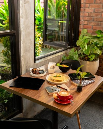 Soft light, comfy seat, and the book you love. The perfect combo for a slow day 🌿📖—Café Sukka⏰